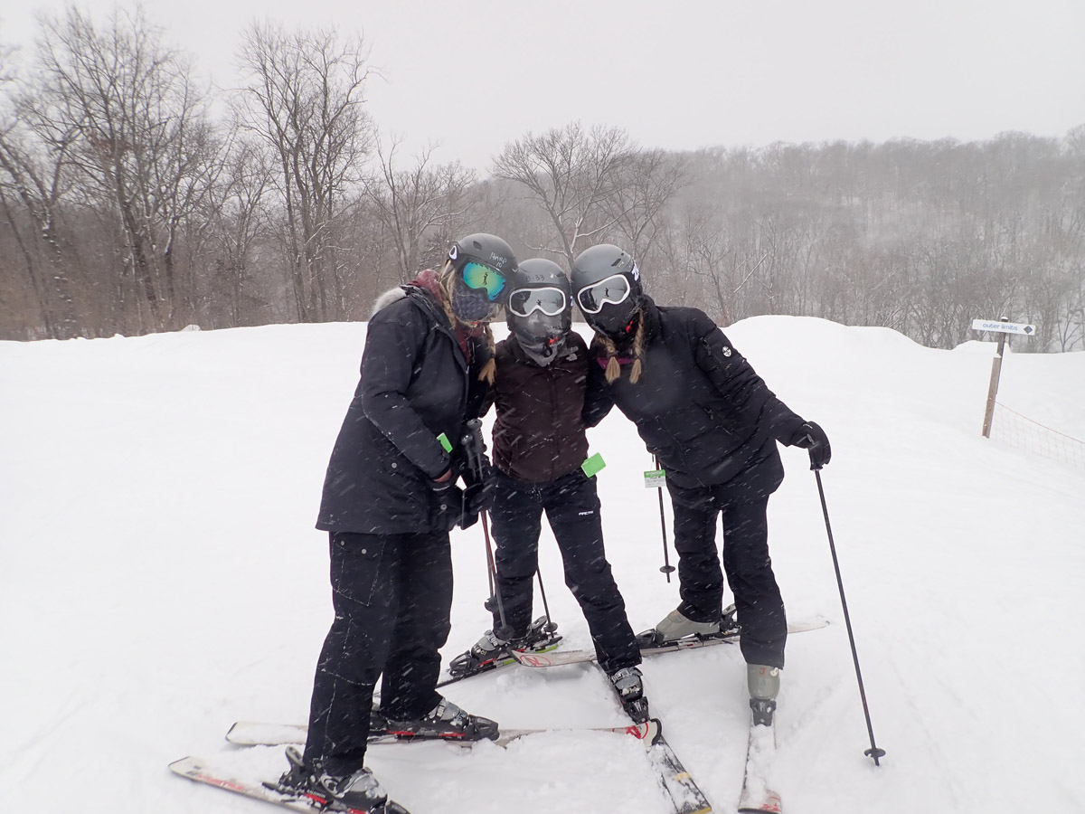 Students posing on a ski slope